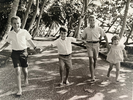 Carolyn Chauncey as a young girl running barefoot on the Lake Trail in Palm Beach with her three older brothers
