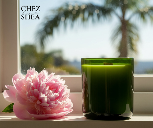 Green glass vessel with pink peony with palm tree